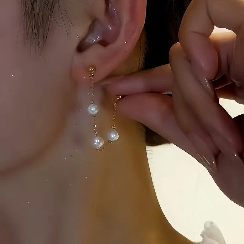 Close-up detail of the sparkling zircons and plating on the Front and Back Pearl Earrings