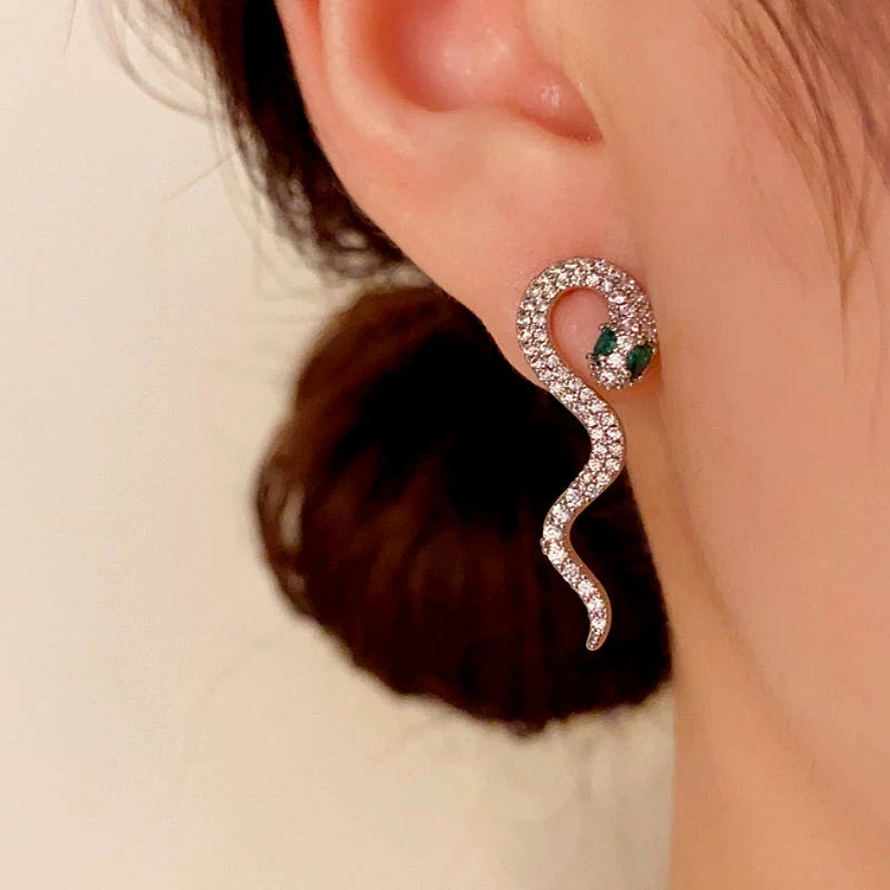 Model showcasing the dangle and style of the 14K Gold-Plated Elegant Full Diamond Snake-Shaped Earrings