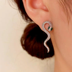 Model showcasing the dangle and style of the 14K Gold-Plated Elegant Full Diamond Snake-Shaped Earrings
