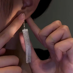 Close-up detail of the sparkling zircons and plating on the Tassel Earrings