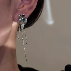 Close-up detail of the sparkling zircons and plating on the Geometric Tassel Earrings