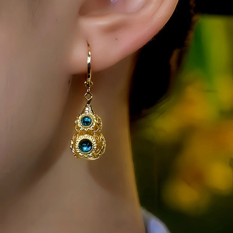 Close-up detail of the sparkling zircons and plating on the Gourd Earrings