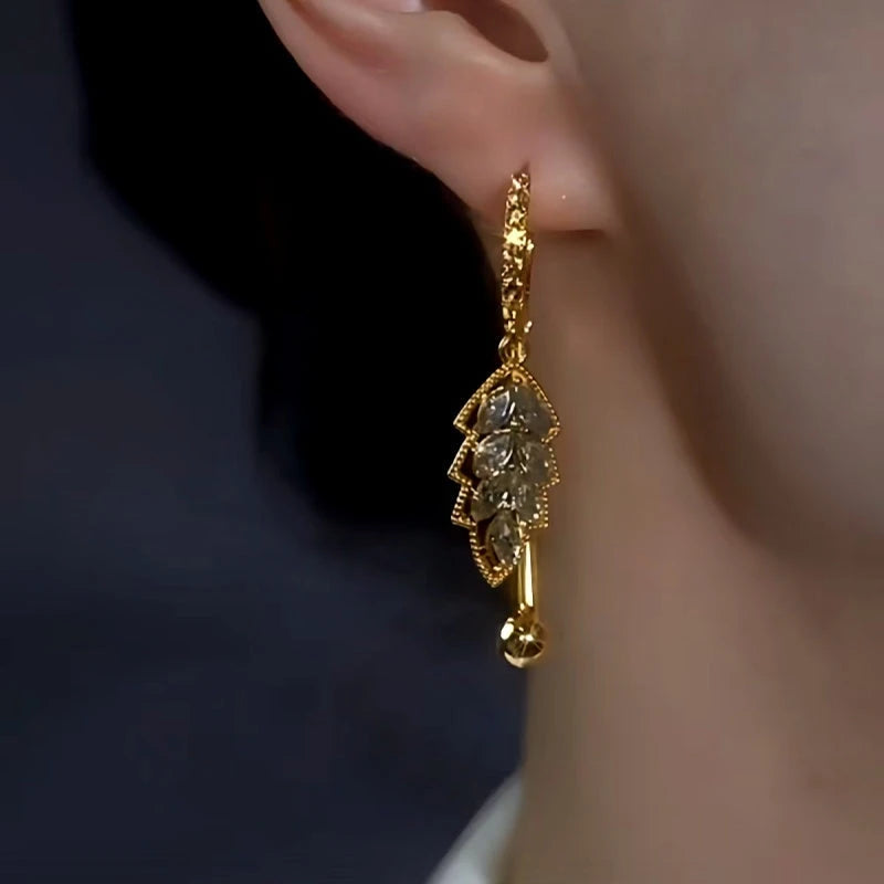 Close-up detail of the sparkling zircons and plating on the Leaf Earrings