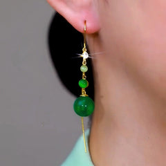 Close-up detail of the sparkling zircons and plating on the Tassel Threader Earrings