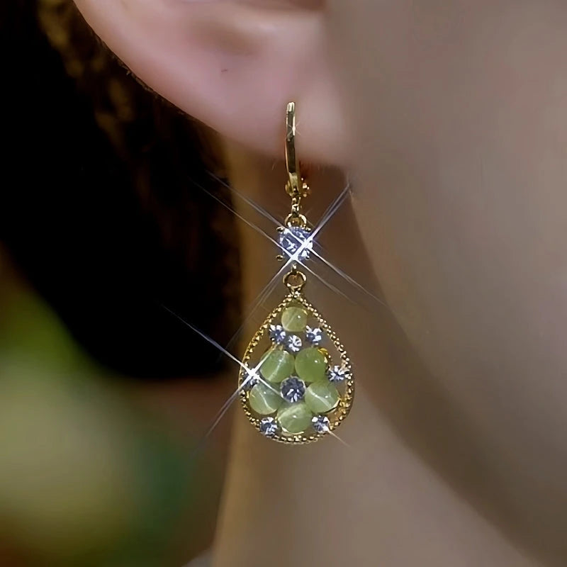 Close-up detail of the sparkling zircons and plating on the Green Water Drop Earrings