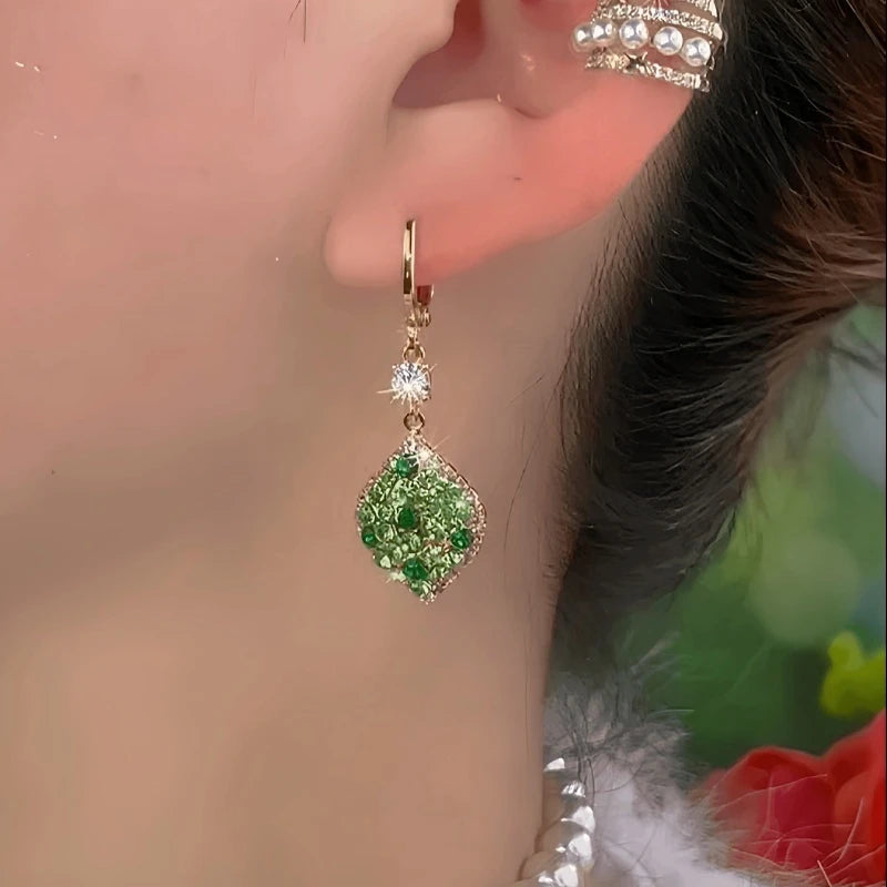 Close-up detail of the sparkling zircons and plating on the Green Water Drop Earrings