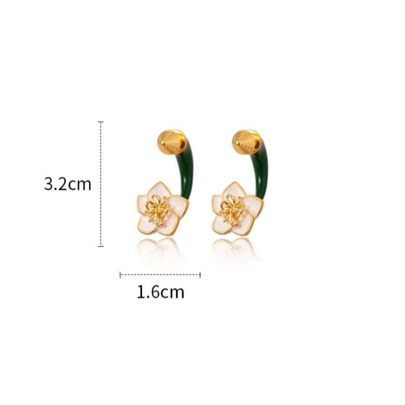 Close-up detail of the sparkling zircons and plating on the Green Enamel Flower Earrings