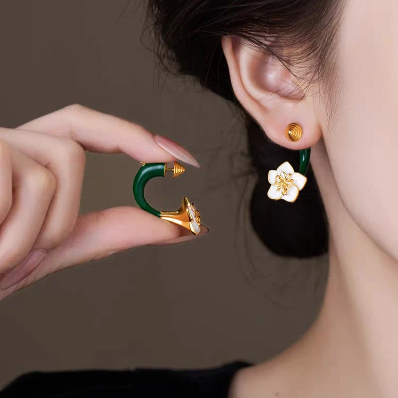 Angled view of the 14K Gold-Plated Elegant Green Enamel Drip Glaze Flower Earrings