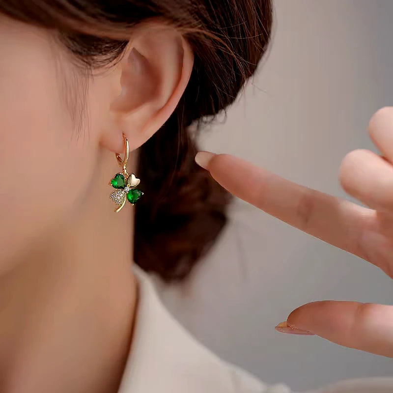 Close-up detail of the sparkling zircons and plating on the Green Flower Earrings