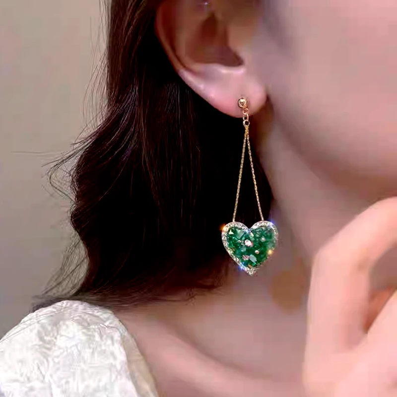 Close-up detail of the sparkling zircons and plating on the Heart Tassel Earrings