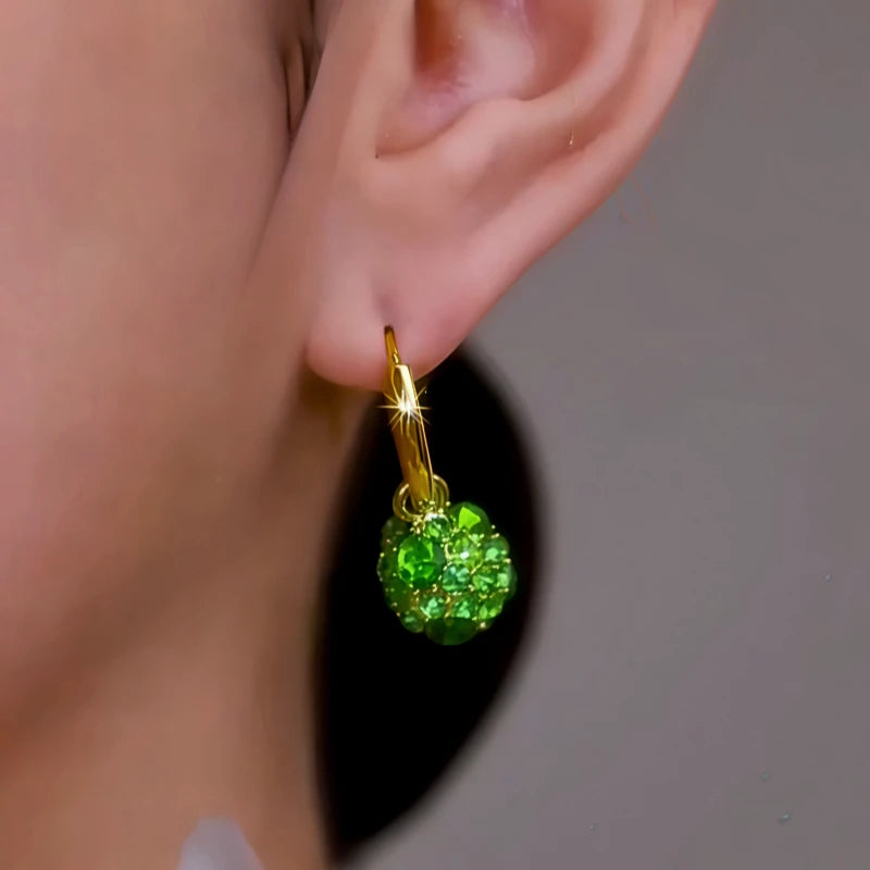 Close-up detail of the sparkling zircons and plating on the Green Zircon Earrings