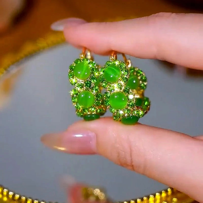 Close-up detail of the sparkling zircons and plating on the Cat's Eye Hoop Earrings