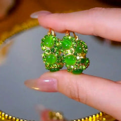 Close-up detail of the sparkling zircons and plating on the Cat's Eye Hoop Earrings