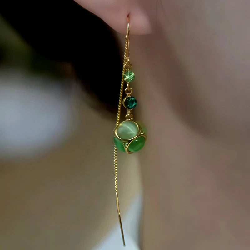 Close-up detail of the sparkling zircons and plating on the Cat's Eye Threader Earrings