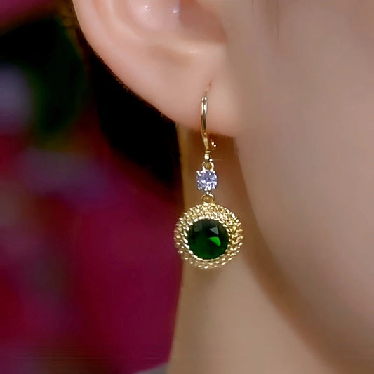 Model showcasing the dangle and style of the 14K Gold-Plated Elegant Green Zircon Diamond Earrings
