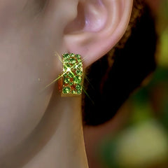 Close-up detail of the sparkling zircons and plating on the Green Zircon Hoops