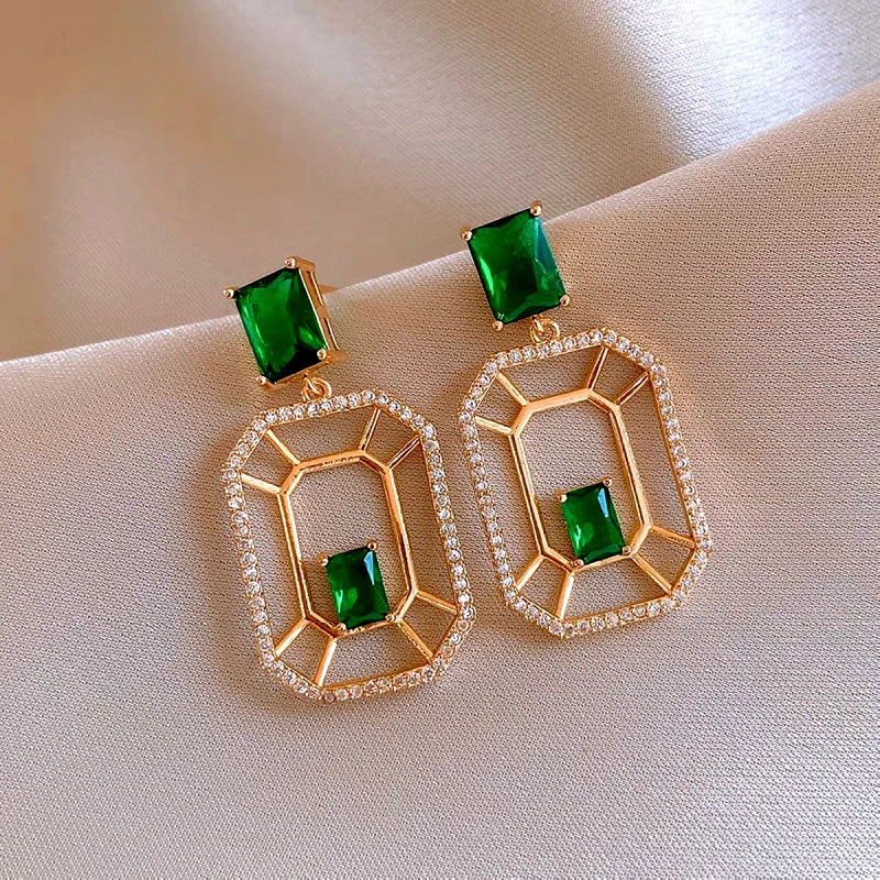 Model showcasing the dangle and style of the 14K Gold-Plated Elegant Green Zircon Diamond Rectangular Earrings