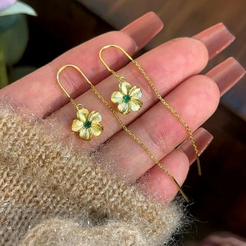 Angled view of the 14K Gold-Plated Elegant Green Zircon Diamond Threader Earrings