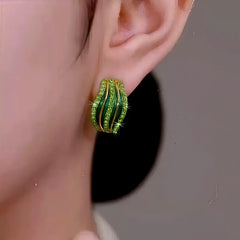 Close-up detail of the sparkling zircons and plating on the Green Zircon Studs