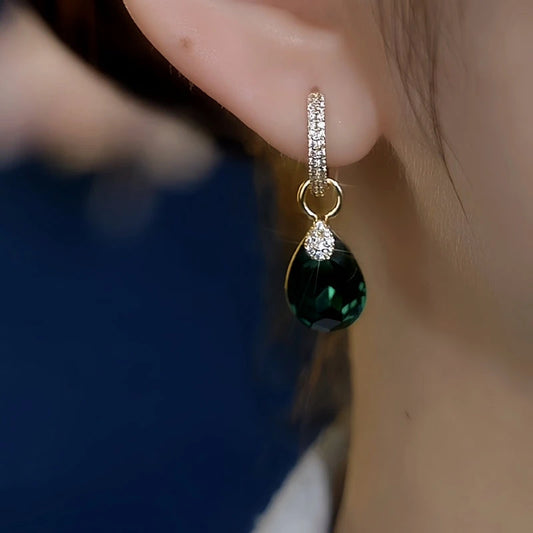 Model showcasing the dangle and style of the 14K Gold-Plated Elegant Green Zircon Water Drop Earrings
