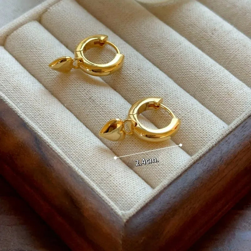 Angled view of the 14K Gold-Plated Elegant Heart Earrings
