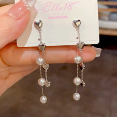 Close-up detail of the sparkling zircons and plating on the Pearl Tassel Earrings