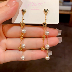 Angled view of the 14K Gold-Plated Elegant Heart Pearl Tassel Earrings