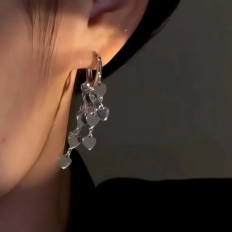 Close-up detail of the sparkling zircons and plating on the Heart Tassel Earrings