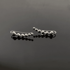 Close-up detail of the sparkling zircons and plating on the Heart Crawler Earrings