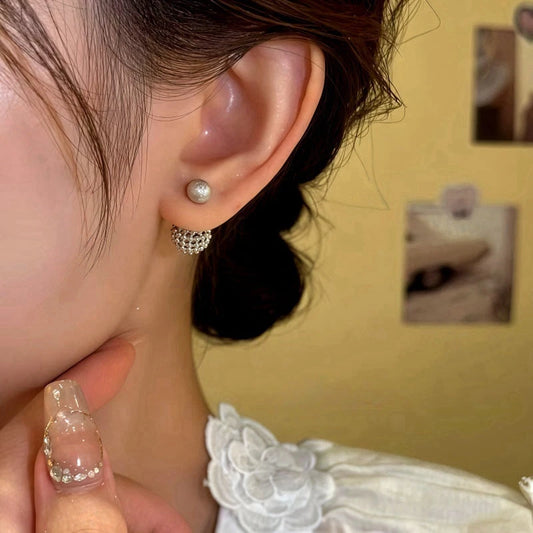 Model showcasing the dangle and style of the 14K Gold-Plated Elegant Hollow Ball jacket Earrings