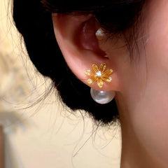 Close-up detail of the sparkling zircons and plating on the Flower Pearl Jacket Earrings