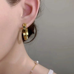 Close-up detail of the sparkling zircons and plating on the Gold Hoop Earrings