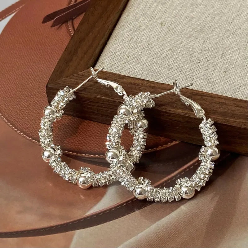 Angled view of the 14K Gold-Plated Elegant Hoop Earrings