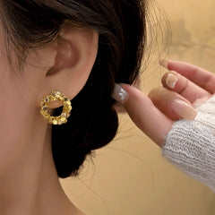 Model showcasing the dangle and style of the 14K Gold-Plated Elegant Hoop Stud Earrings