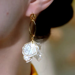 Close-up detail of the sparkling zircons and plating on the Petal Tassel Earrings