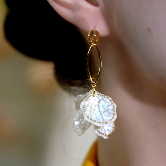 Model showcasing the dangle and style of the 14K Gold-Plated Elegant Ice Cracked Petal Tassel Earrings