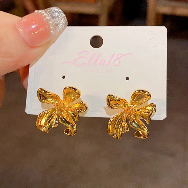 Angled view of the 14K Gold-Plated Elegant Irregular Flower Stud Earrings