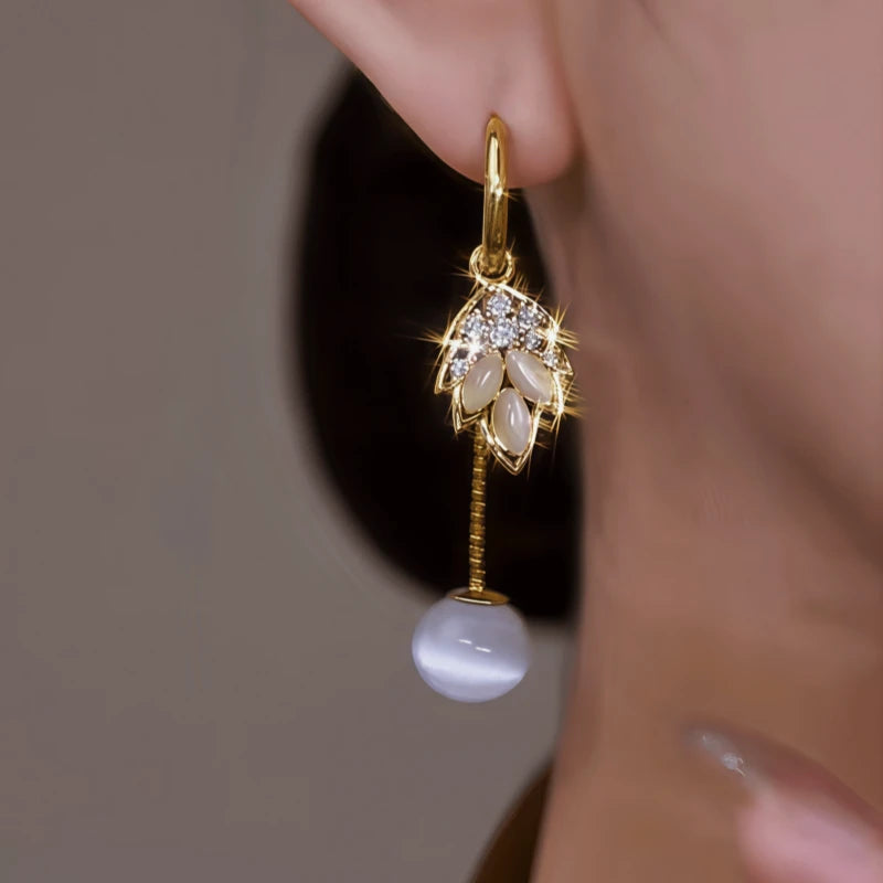 Close-up detail of the sparkling zircons and plating on the Jade Leaf Earrings