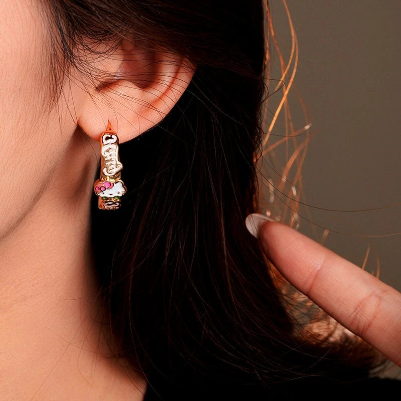 Close-up detail of the sparkling zircons and plating on the Kitten C-Shaped Earrings