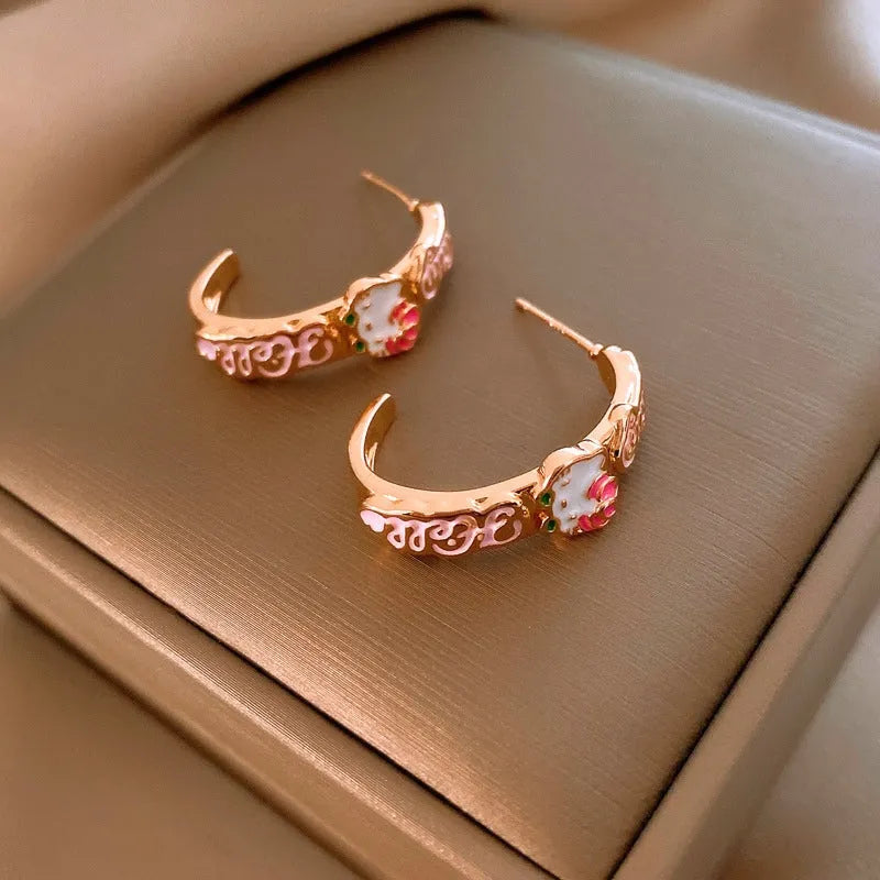 Angled view of the 14K Gold-Plated Elegant Kitten C-Shaped Earrings