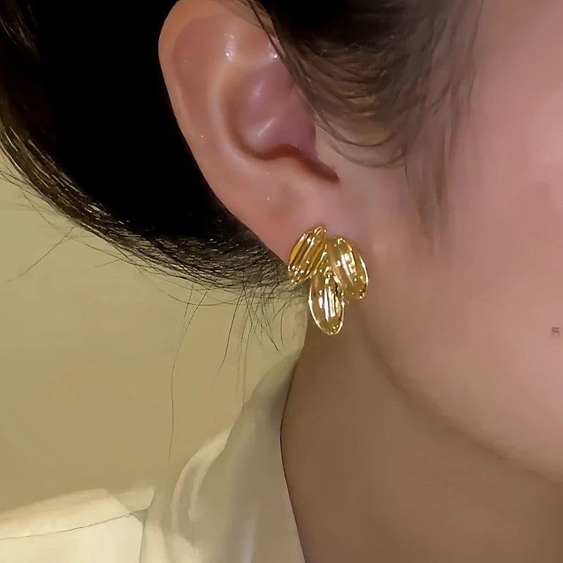 Close-up detail of the sparkling zircons and plating on the Leaf Stud Earrings