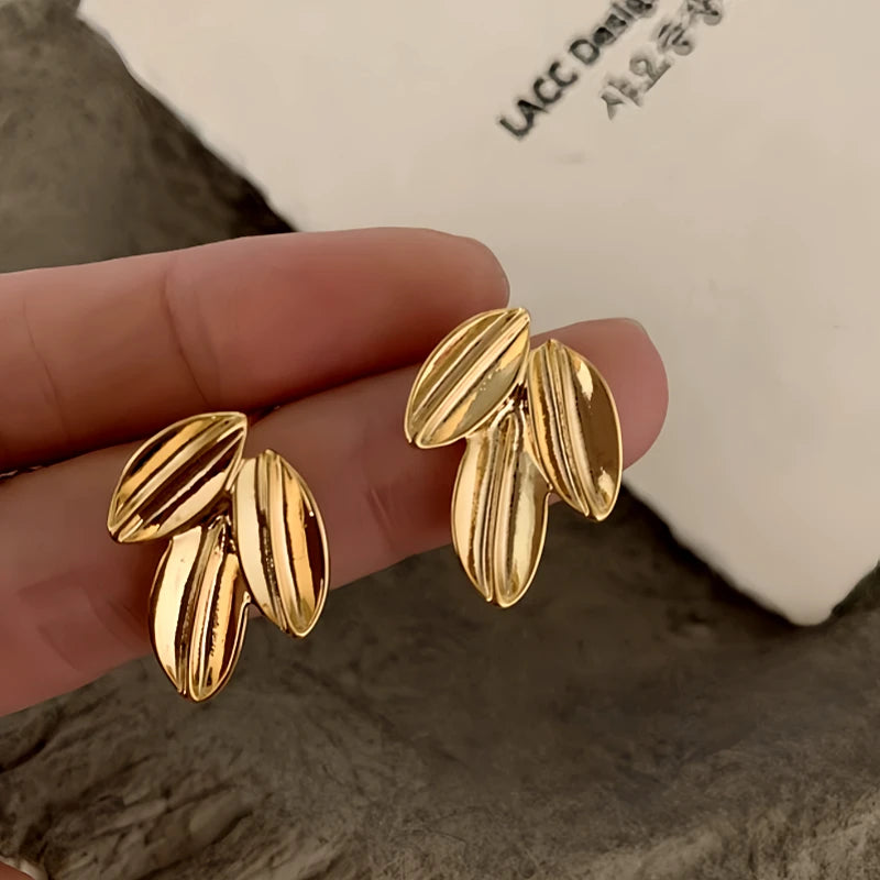 Angled view of the 14K Gold-Plated Elegant Leaf Stud Earrings