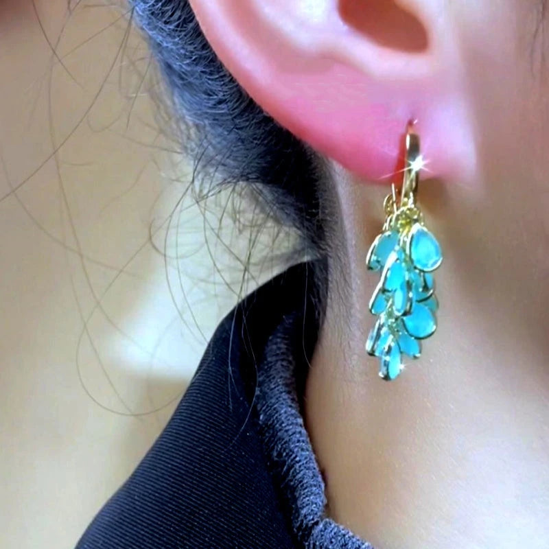 Close-up detail of the sparkling zircons and plating on the Leaf Tassel Earrings