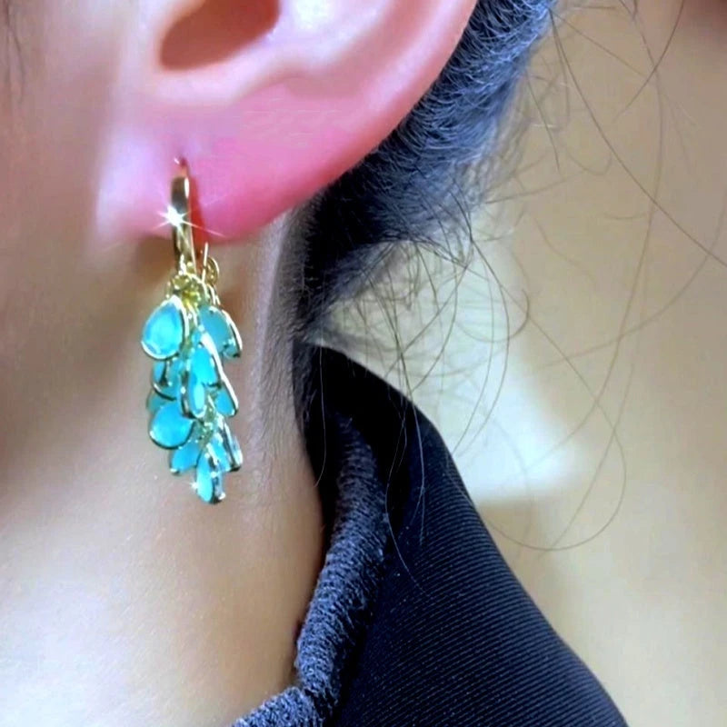 Angled view of the 14K Gold-Plated Elegant Leaf Tassel Earrings
