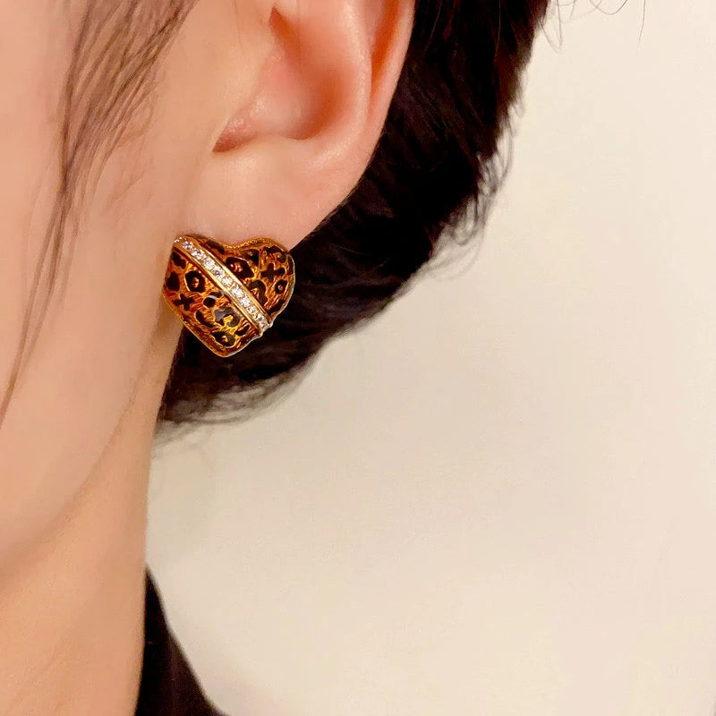 Close-up detail of the sparkling zircons and plating on the Leopard Heart Studs