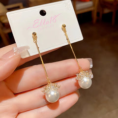 Close-up detail of the sparkling zircons and plating on the Long Pearl Earrings