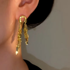 Angled view of the 14K Gold-Plated Elegant Long Tassel Earrings
