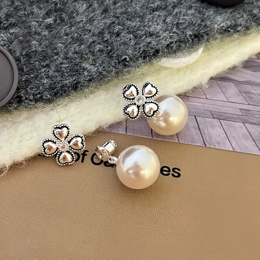 Model showcasing the dangle and style of the 14K Gold-Plated Elegant Lucky Grass Bead Earrings