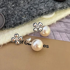 Model showcasing the dangle and style of the 14K Gold-Plated Elegant Lucky Grass Bead Earrings