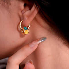 Close-up detail of the sparkling zircons and plating on the Luxury Cat's Eye Earrings